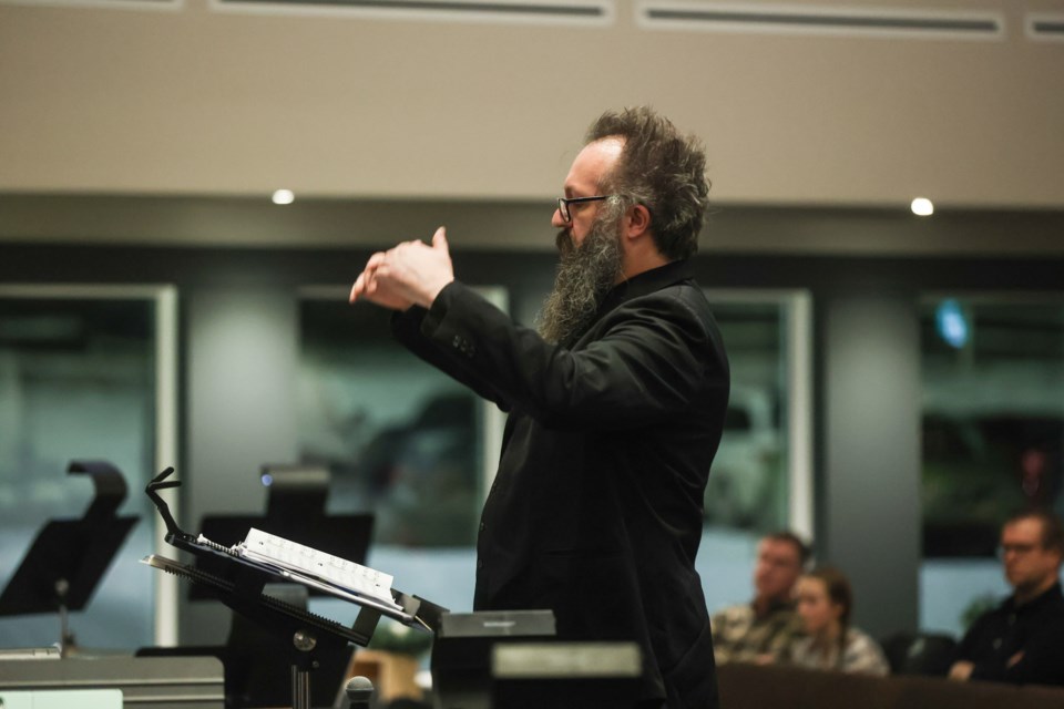 Tim Korthuis conducts the Foothills Philharmonic Chorus in their concert 'Sing We Now of Christmas' at the Okotoks Alliance Church on Dec. 10. The joint concert with the Foothills Philharmonic Orchestra and Chorus marked the first full-scale Christmas performance since 2019.