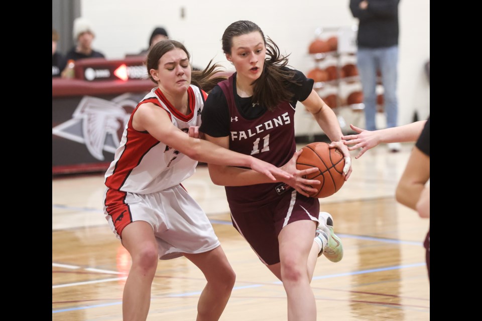 Foothills Falcon Tia Glazier sidesteps a McCoy Colts defender on Jan. 27 at the Falcons' Sheep River Shootout Tournament. The Falcons won bronze at the competition. 