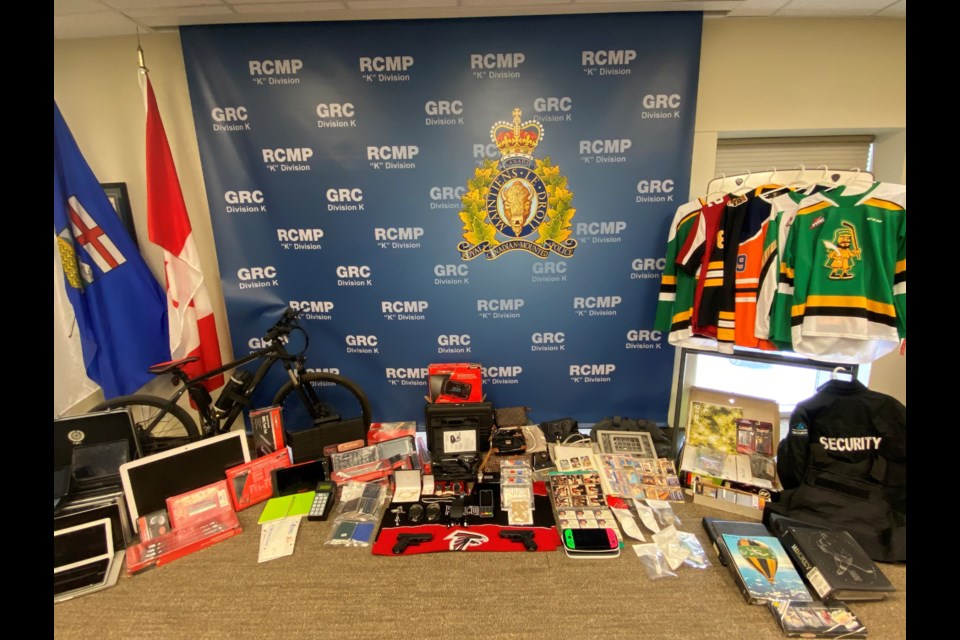 Two Calgary residents have been charged in relation to a series of break-and-enters in Foothills County where various valuable items were stolen. 