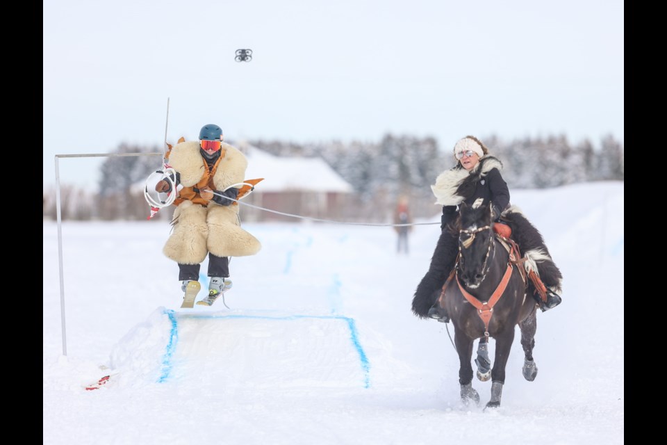 Seth Hiller makes the final jump in the circuit towed behind Bonnie Hosgson on MV during Skijordue at the Calgary Polo Club on Feb. 25.