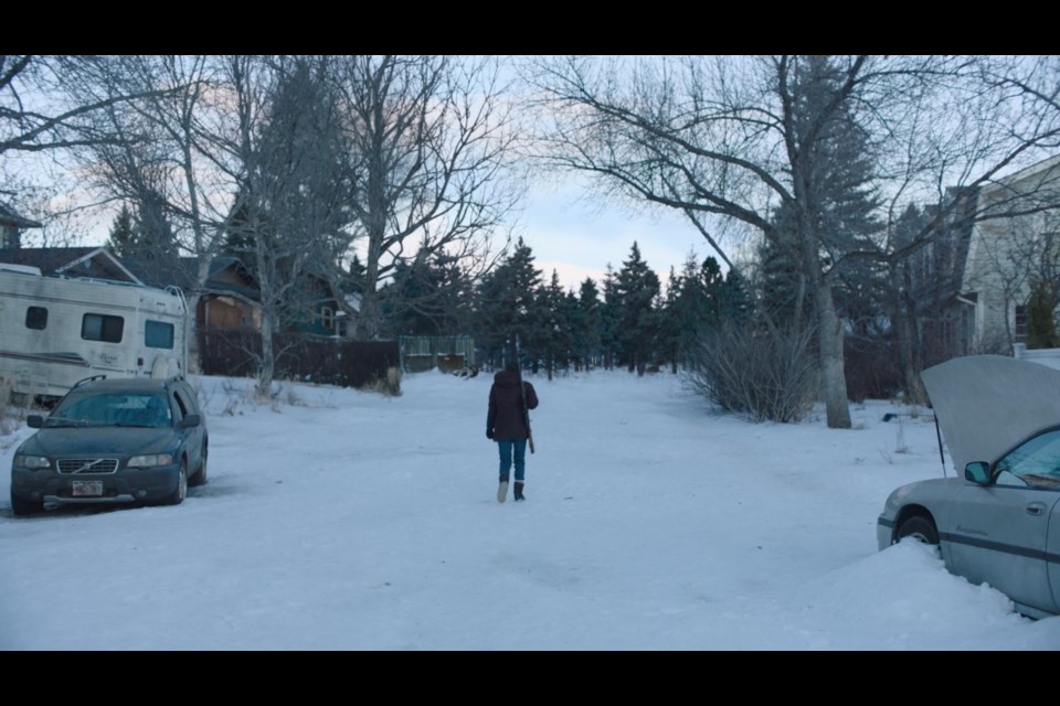 Ellie (played by Bella Ramsey) walks down Okotoks' Suntree Lane in HBO's 'The Last of Us'.