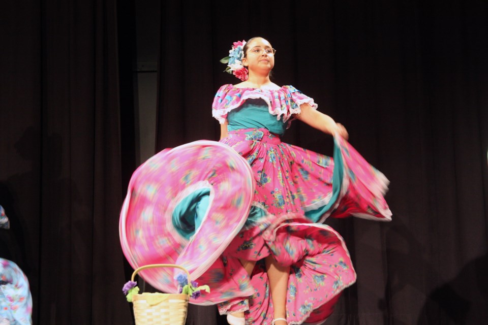 A dancer from the Mexican, Latino and Cross-Cultural Society of High River performs at the event marking the International Day for the Elimination of Racial Discrimination at the Foothills Centennial Centre on March 21.