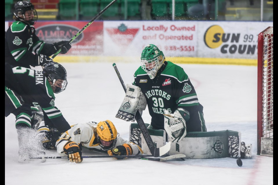 Carter Esler of the Okotoks U15 AAA Oilers protects the crease against the KC Squires in the provincial bronze medal game at Okotoks Centennial Arenas on March 26. Okotoks won by a 7-3 score. 