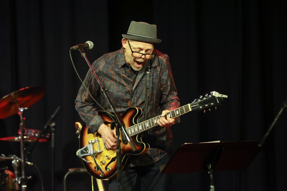 Blues artist John Rutherford plays in the Roots & Blues Weekend at the Rotary Performing Arts Centre April 22, 2023, accompanied by Aaron Scholpp on bass and Kelly Kruse on drums.