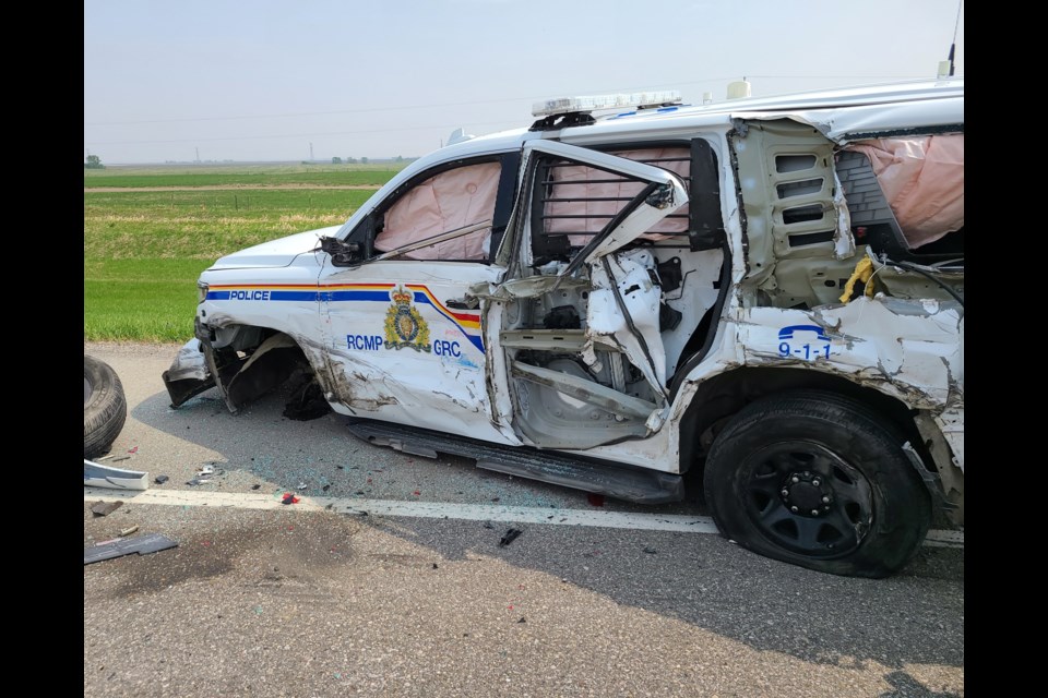 A Claresholm RCMP cruiser was struck by a semi during a traffic stop on Highway 2 near Stavely on May 19.