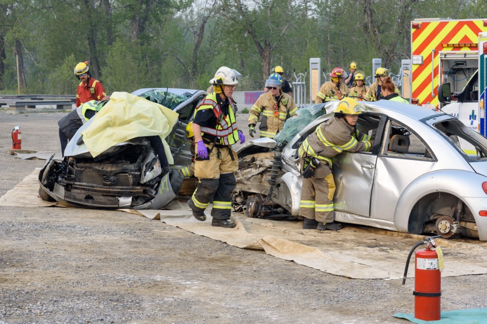 First responders assess the scene of a mock two-car accident during Operation Prevention in Diamond Valley on May 17. 
