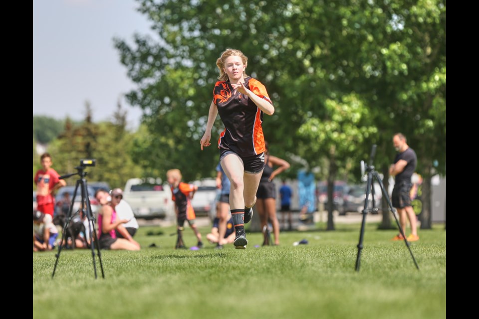 Leah Burwell tests her sprint speed during the Foothills Lions' Try Rugby Day at Bill Robertson Park on May 28.