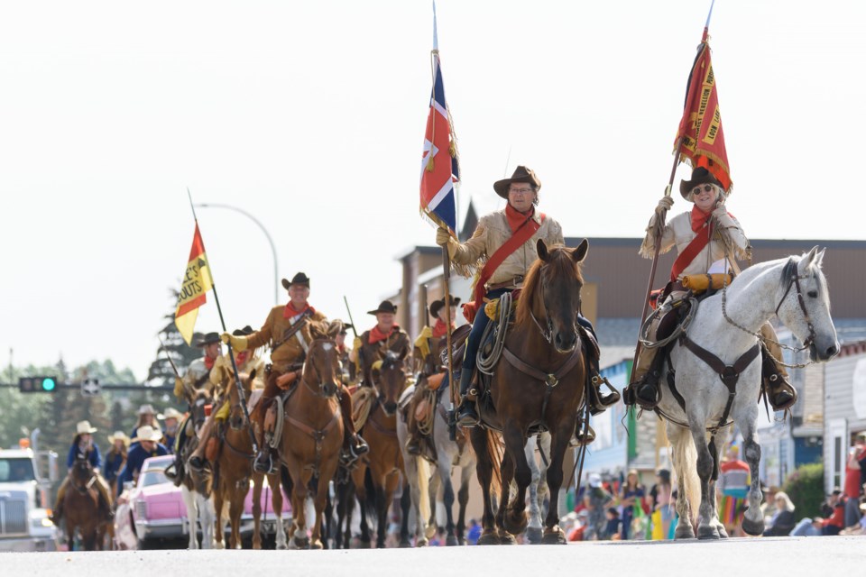 Steele's Scouts make their way down Centre Avenue in Diamond Valley during the Town's parade on June 3, 2023. 