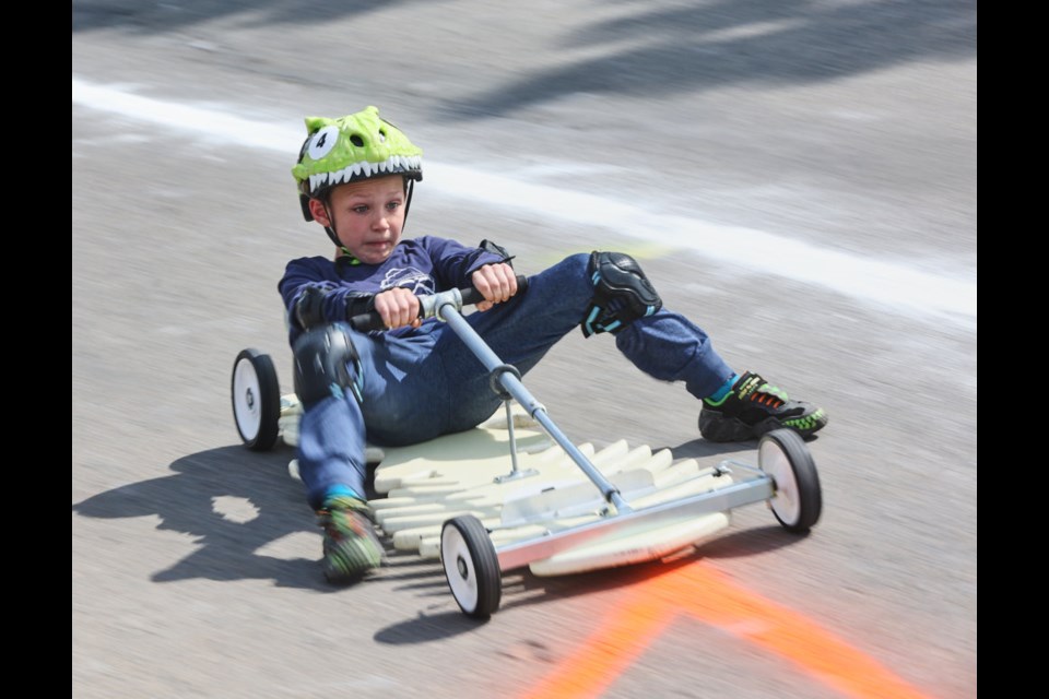 Bishop Ross skids to a halt at the finish line during the 33rd annual Soap Box Derby on June 3.