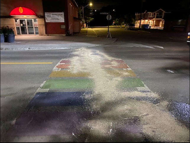The Town of Okotoks posted a photo to Facebook on June 14 depicting vandalism to the Pride crosswalk at Elizabeth Street and Elk Avenue.
