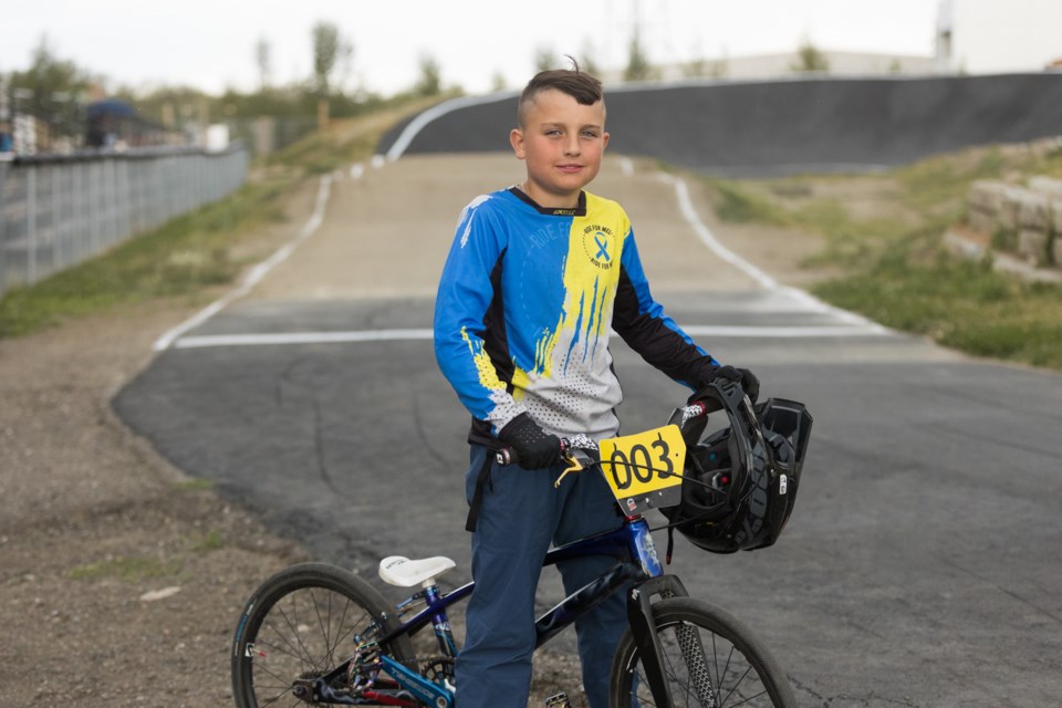 Okotoks BMX racer Jaxon Burke poses at the track on July 27. The young biker is headed to world championships in Glasgow, Scotland.