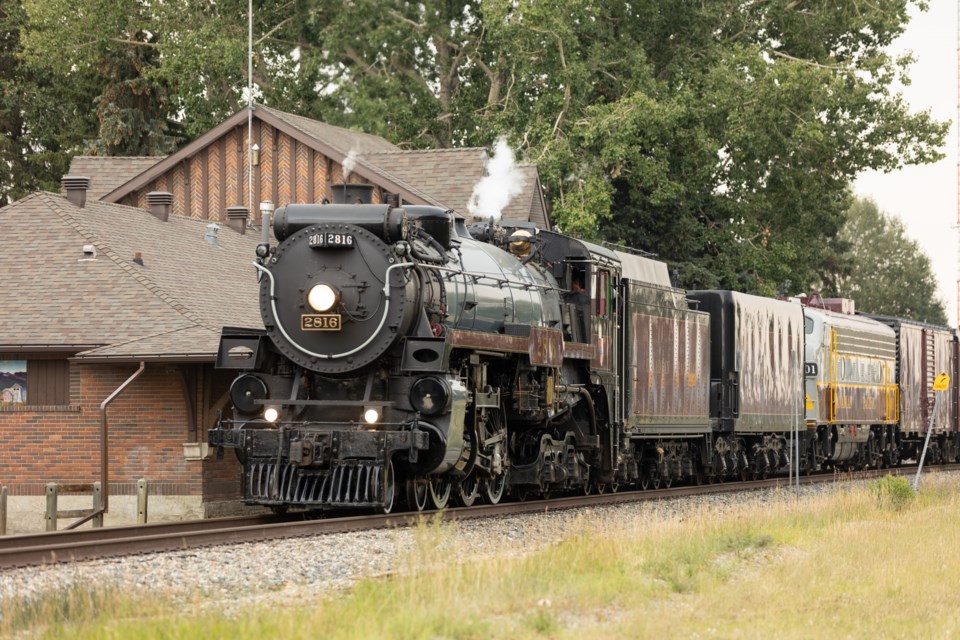 Canadian Pacific's 2816 'Empress' steam train passes through Okotoks on the way to Calgary on Friday, Aug. 4, 2023. Returning from a trip to Lethbridge the day prior, the run was a test in advance of a trip from Calgary to Mexico City setting out April 14, 2024 to commemorate the merger with Kansas City Southern to form Canadian Pacific Kansas City (CPKC).