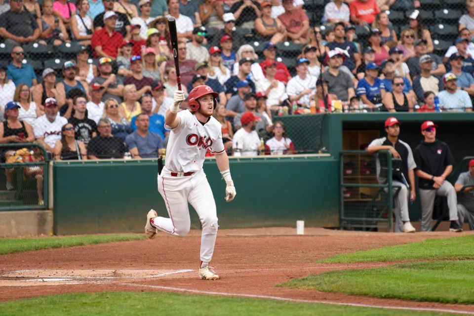 Okotoks Dawgs infielder Brendan Luther watches his home run leave the park against the Medicine Hat Mavericks in Game 1 of the Western Canadian Baseball League Final at Seaman Stadium in Okotoks on Aug. 15. Okotoks won 8-0.