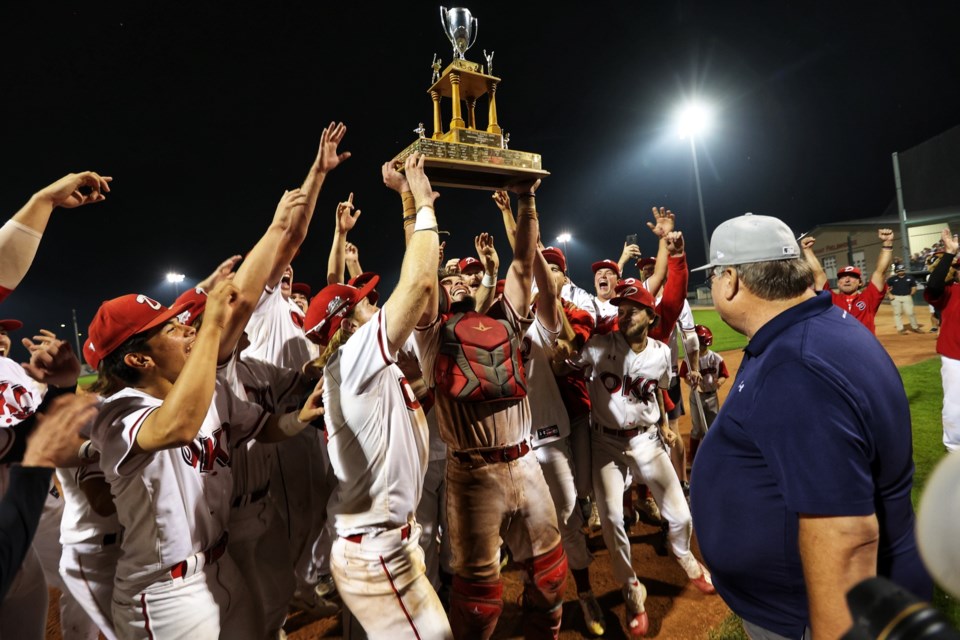 The Okotoks Dawgs celebrate after winning the WCBL championship in a 13-5 win over the Medicine Hat Mavericks on Aug. 17 at Seaman Stadium.