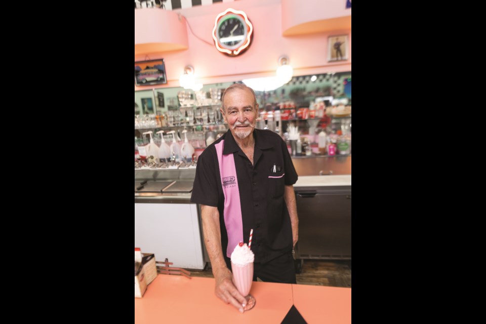 Marv Garriott, proprietor of Marv's Classic Soda Shop, with his new Barbie Milkshake on July 27.