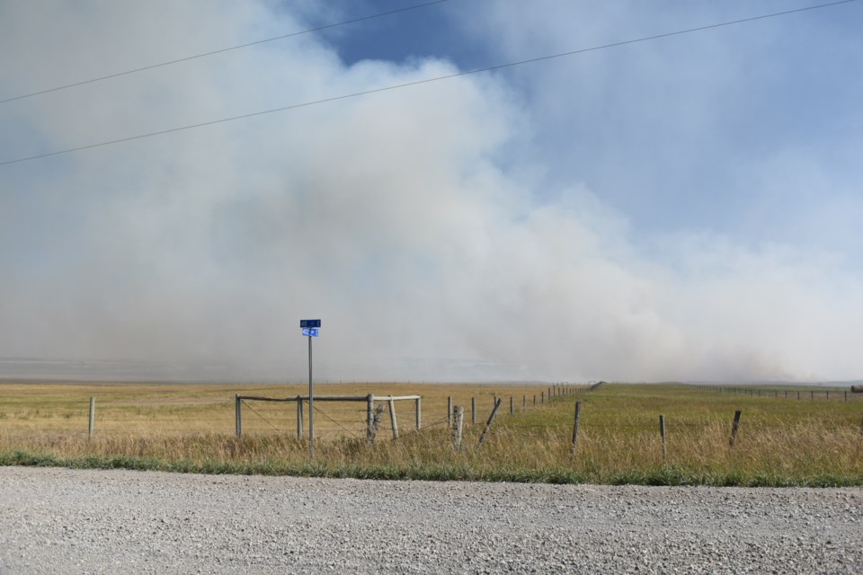 A grass fire burning near 48 Street and 418 Avenue East in Foothills County on Aug 29.