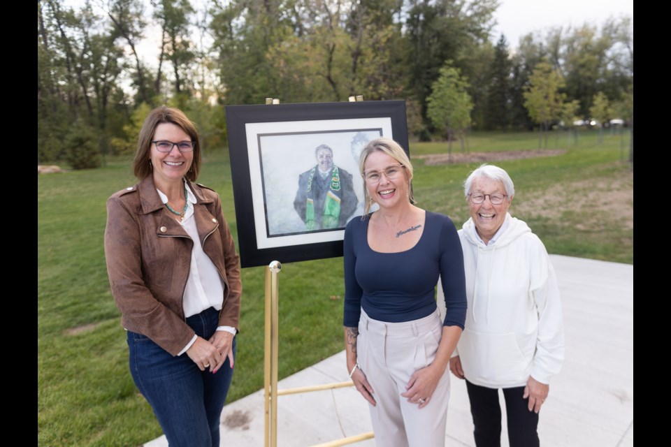 Inaugural Sheep River artist in residence Tanya Zakarow (centre) poses with Okotoks Mayor Tanya Thorn (left) and Marg Cox at an event announcing the subjects of her portrait project at the Okotoks Public Library on Sept. 6. 