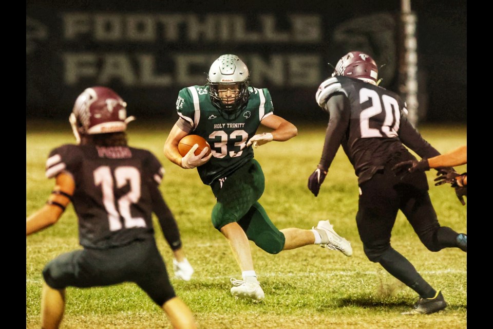 HTA Knights runningback Seth Poelzer looks for running room versus the Foothills Falcons defence during the 34-24 victory for HTA on Sept. 15 at Falcons Field. 