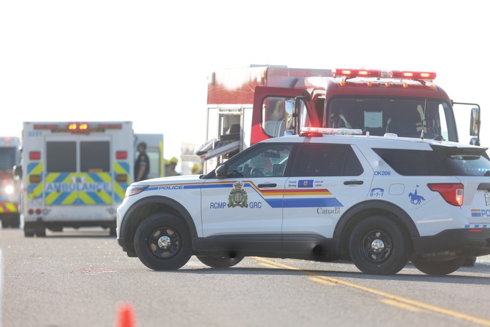 Emergency crews work at the scene of a three-vehicle collision on Highway 7 just west of 70 Street W on Sept. 22.