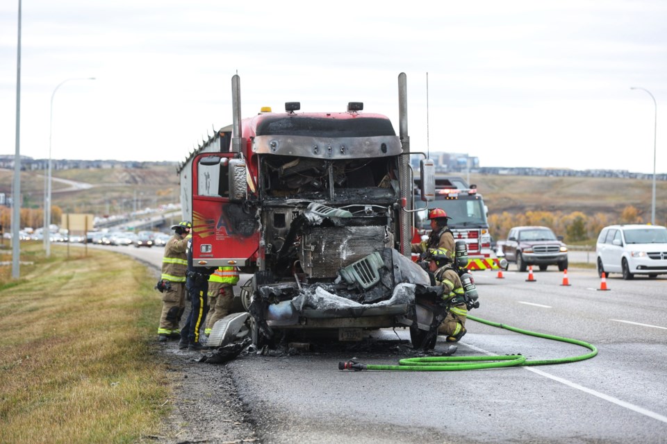 Emergency crews deal with a burnt out semi on southbound Highway 2 just after the Bow River bridge. Foothills Fire Department's Heritage Pointe station was dispatched to a semi fully engulfed in flames, but no one was injured.