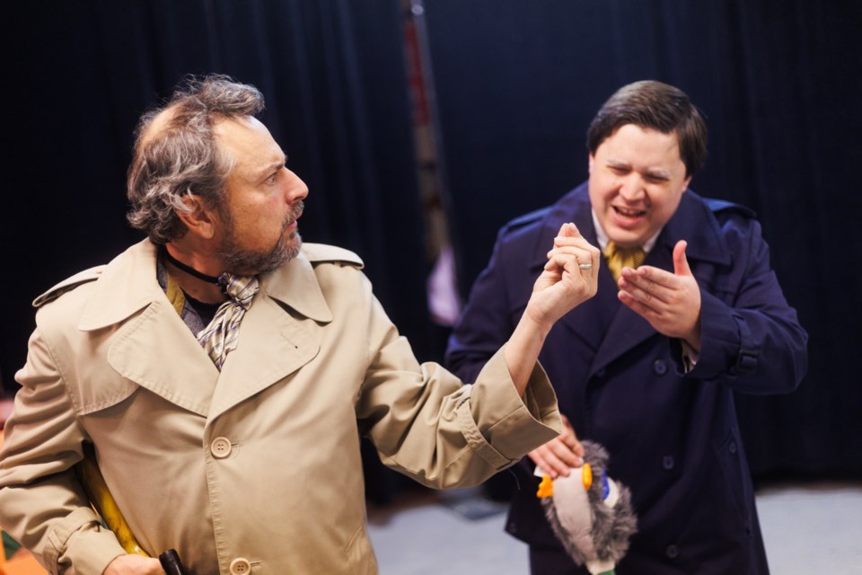 Bullshot Crummond (left, played by Dave Hall) raises some dubious evidence to his friend Algy (Daniel Rose) in a rehearsal for the Dewdney Players' 'Bullshot Crummond'. The play opens Oct. 20 at the Rotary Performing Arts Centre.
