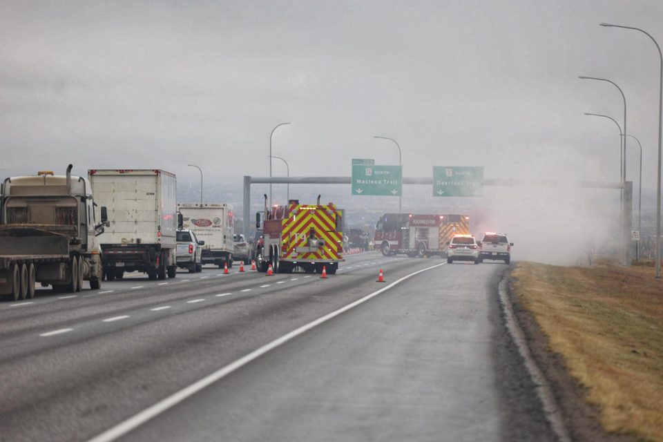 Emergency crews respond to a vehicle fire on Highway 2 north of Okotoks on Oct. 12.