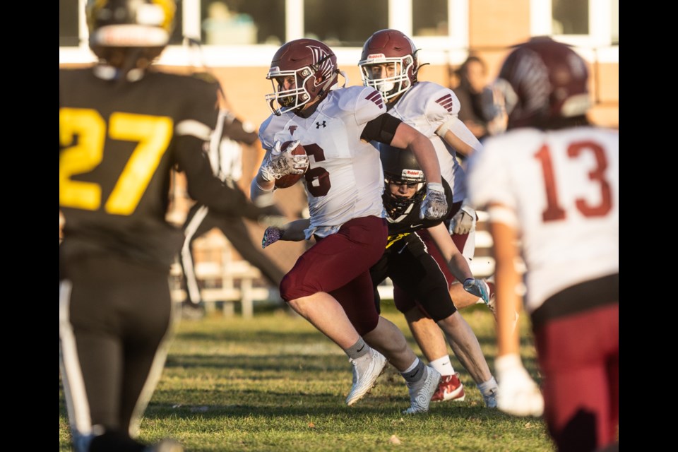 Jamison Kloster of the Foothills Falcons runs in a touchdown versus the Joane Cardinal-Schubert Ravens at Falcons Field on Oct. 19. Foothills won by a 49-14 score.