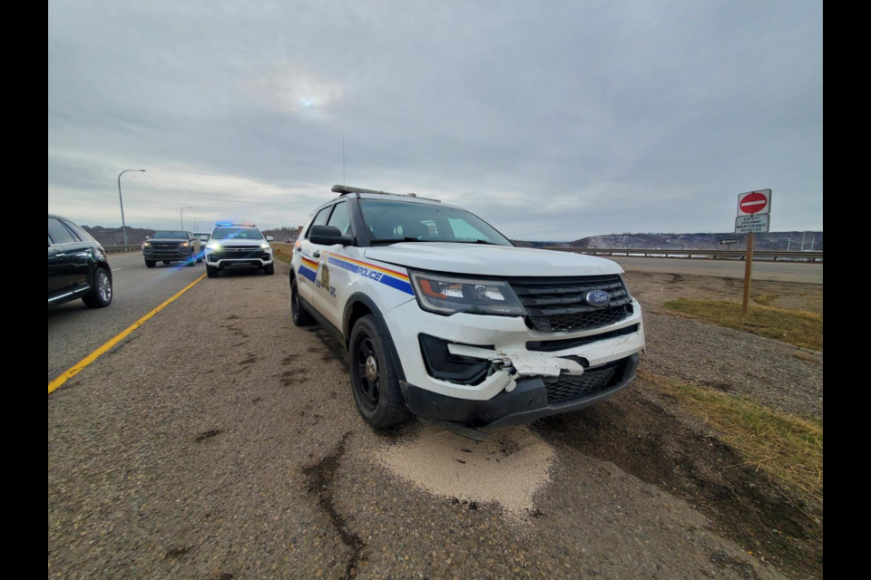 An RCMP crusier was damaged in a hit-and-run collision on Highway 2 north of Okotoks on Nov. 2.