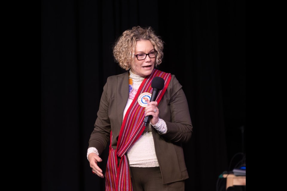Amber Boyd, the district captain of the Otipemisiwak Métis Government (OMG) of the Métis Nation within Alberta Rocky View District #4, speaks at the Rotary Performing Arts Centre in Okotoks for Louis Riel Day on Nov. 16. The day falls within Métis Week, from Nov. 12-18.
