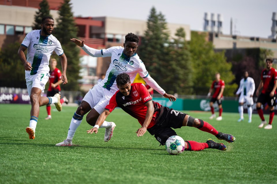 Cavalry FC’s Shamit Shome battles with York United’s Kévin Santos during the CPL match on Sept. 23 at York Lions Stadium. The Cavalry won the match by a 1-0 score.