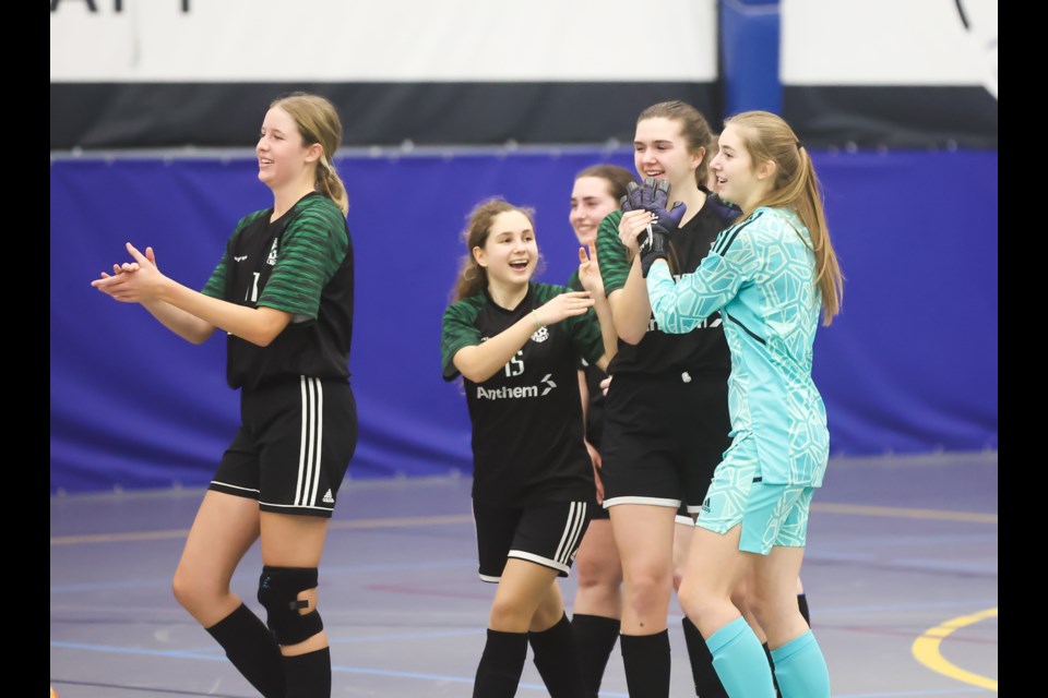 The Okotoks United Girls U17 futsal team celebrate their win over the Calgary Rangers at the Cavalry FC Fieldhouse at the 2023 Anthem Communities Cup. This year's event runs during the Jan. 12-14 and Jan. 19-21 weekends. (Brent Calver/Western Wheel File Photo)