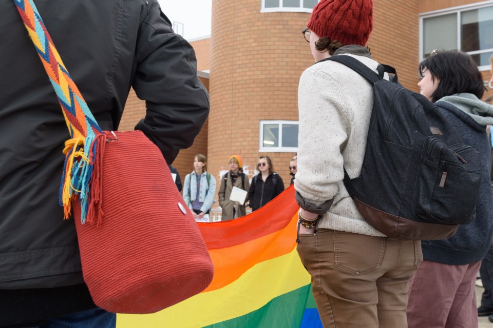 Students held a walkout at Foothills Composite High School in Okotoks on Feb. 7 to protest new policies about gender and sexuality.