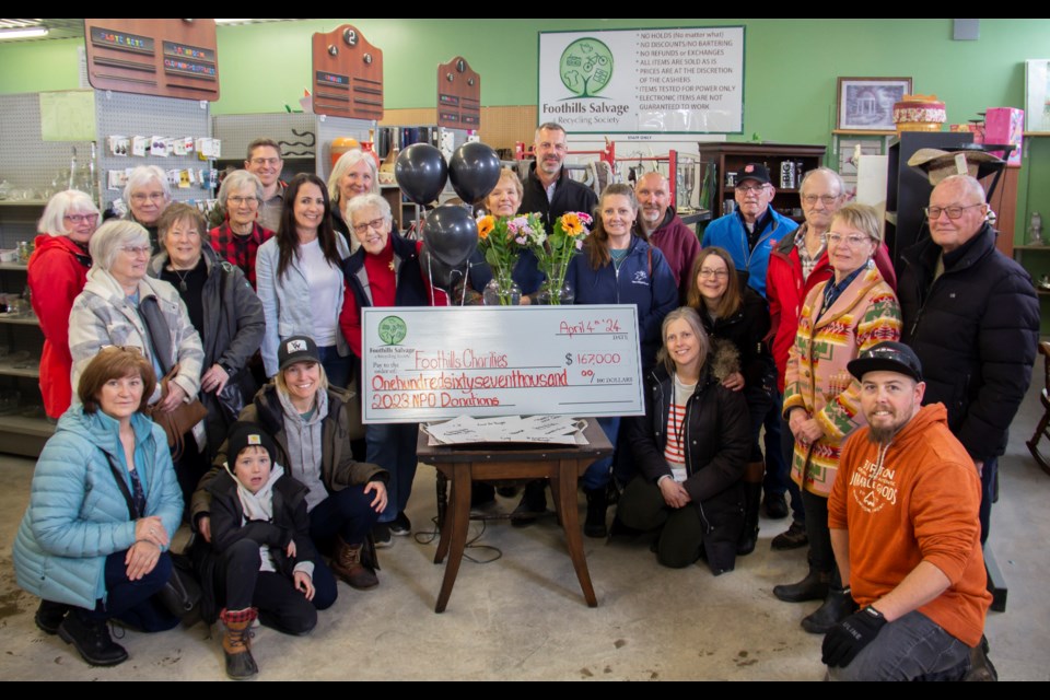 Foothills Salvage & Recycling Society crew, funding recipients and community members gathered for the hefty donation on April 4.