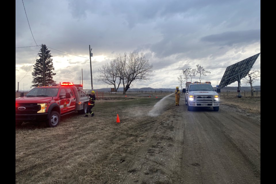 Diamond Valley firefighters conduct a training exercise at the Black Diamond Elk Ranch on April 15.