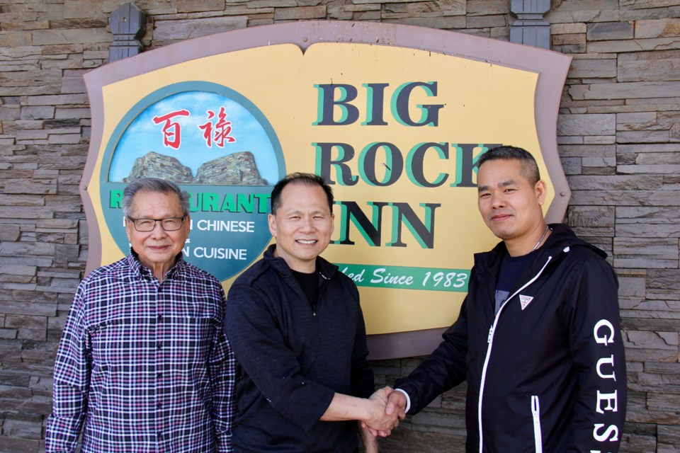 Big Rock Inn current owner William Kwan, son Herman Kwan and new owner Qiangshan Chen.