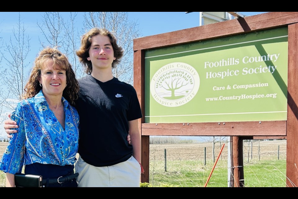 Dr. Ana-Maria Oelschig, medical director of Foothills Country Hospice, and 13-year-old Mason Sharp, who collected and donated over one million pop tabs to the organization. 