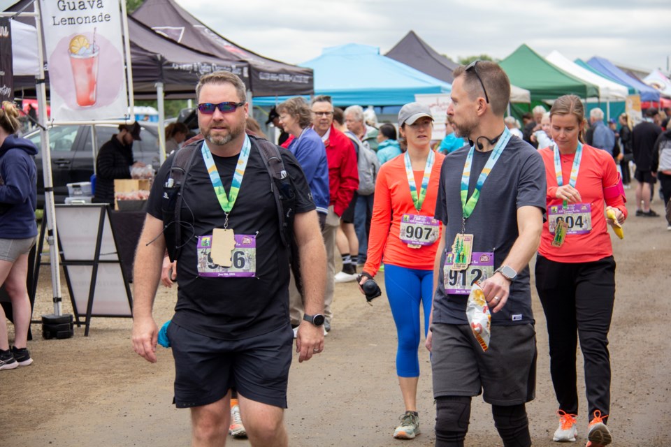 "Run To The Farmers' Market" runners make their way through the Millarville Farmers' Market on June 15.