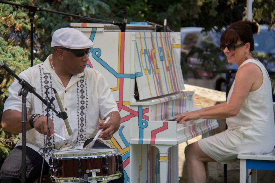 Raul Gomez Tabera and Tricia Edwards perform at Picnic at the Piano outside the Okotoks Art Gallery on July 17.