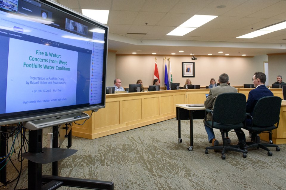Members of the West Foothills Water Coalition make a presentation to Foothills County officials about water availability during a meeting in High River on Feb. 27.