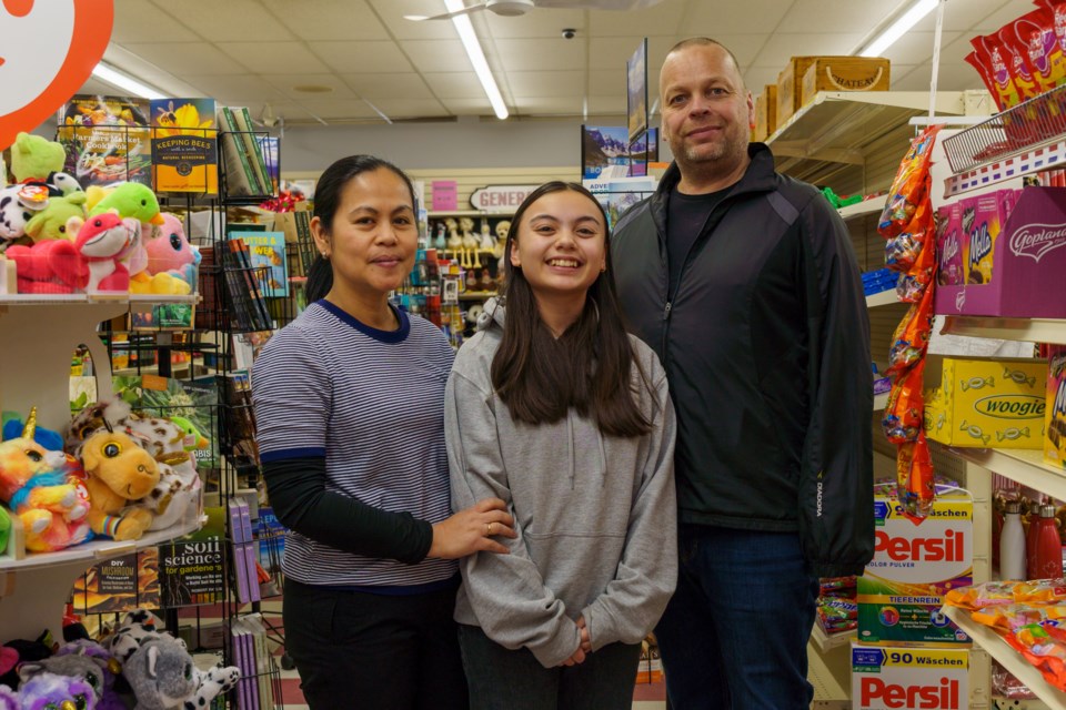 Joy-Ann Lanting (left), Nicole Lanting and Reinier Lanting pose for a photo inside their family-owned business, Dit 'n Dat, on March 28.