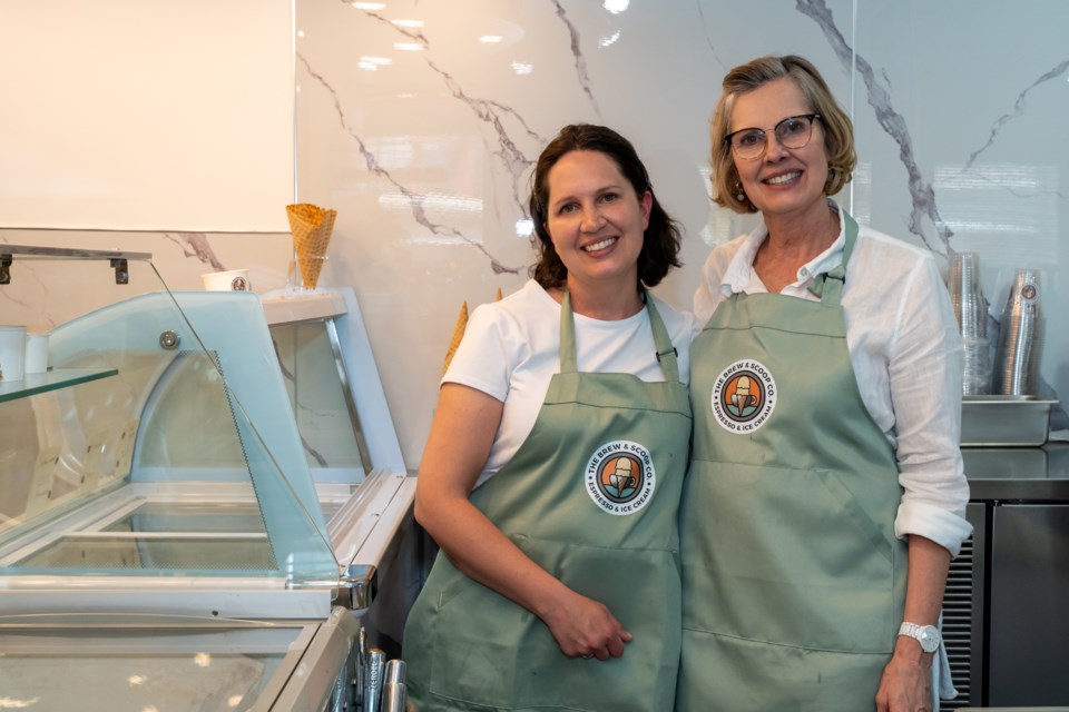 Samantha Van Huigenbos, left, and Henrietta Van Huigenbos pose in their newly opened ice cream and coffee shop The Brew & Scoop Co. in Okotoks on May 10.