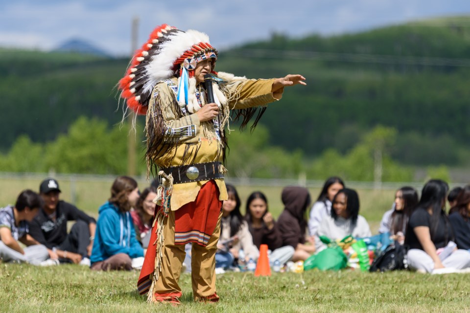Travis Jimmy John speaks to visiting students before a powwow at Chief Jacob Bearspaw School in Eden Valley on June 4.
