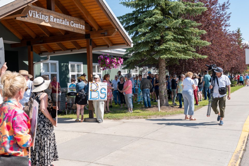 A crowd gathers outside the Viking Rentals Centre in Okotoks for a town hall with Premier Danielle Smith and Highwood MLA RJ Sigurdson on July 2.