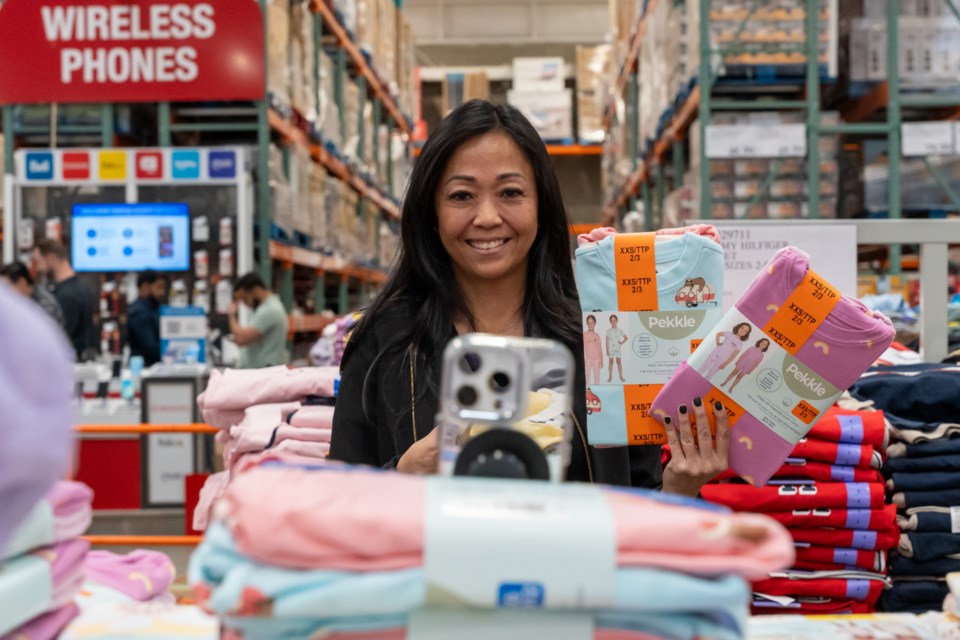 Tina Chow films a video at Costco Wholesale in Okotoks.