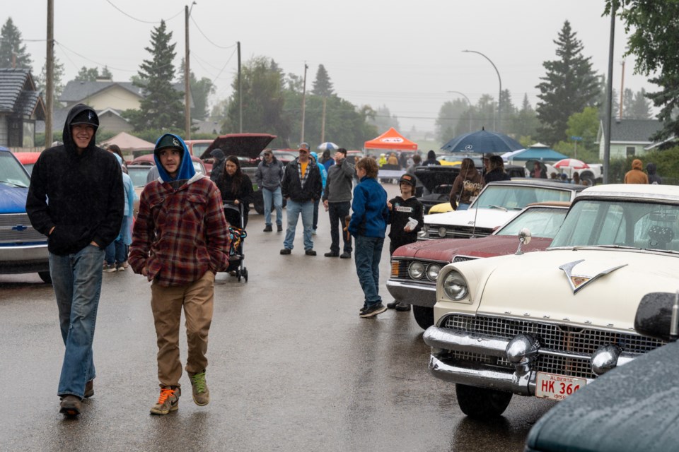 Attendees brave the rain to see a unique collection of cars for the 2025 Diamond Valley Show and Shine on July 27.