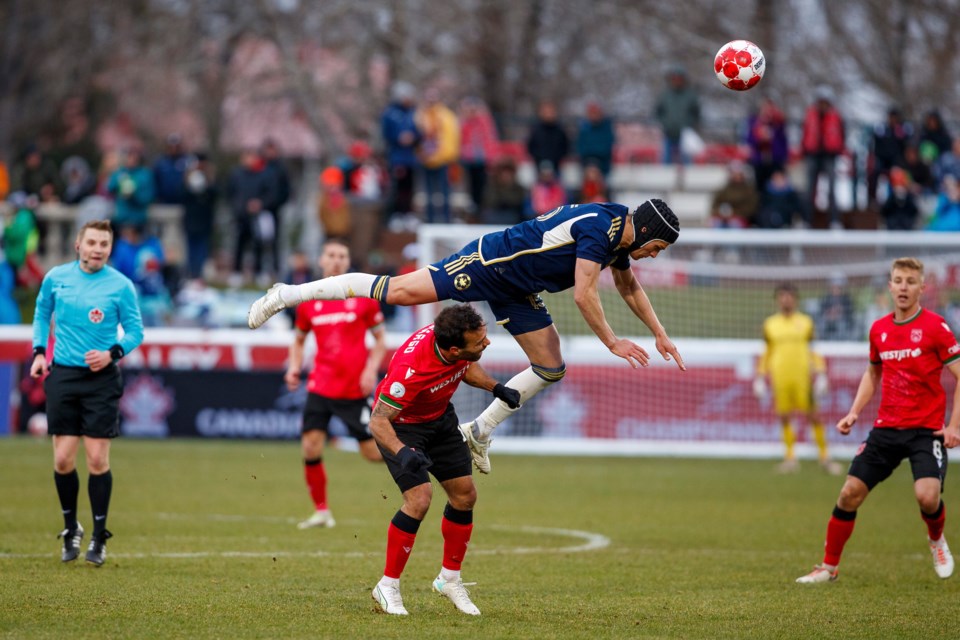 Vancouver Whitecap Bjørn Utvik  and Cavalry FC Sergio Camargo battle during the Canadian Championship clash versus Cavalry FC on May 7 at Spruce Meadows' ATCO Field. The Whitecaps won by a 2-1 score. 