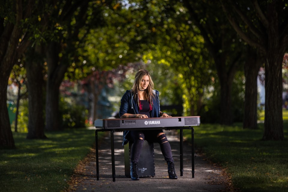 Okotoks singer/songwriter Kelsey Raine poses for a portrait on Sept. 15. Raine has been nominated for the People's Choice Award in Calgary's YYC Music Awards.(BRENT CALVER/Western Wheel)