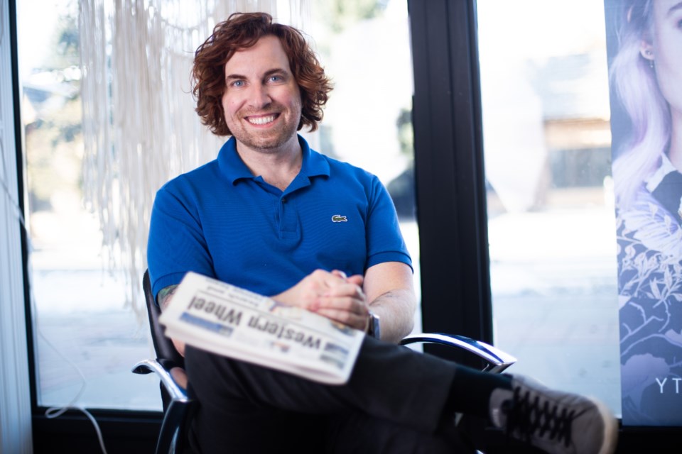 Oliver Hallmark reads the paper every week to see what's going on in the community and keep up with his clients. (BRENT CALVER/Western Wheel)