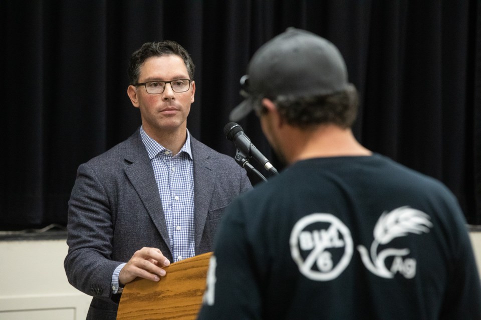 A Foothills County resident addresses Alberta Justice Minister Doug Schweitzer at a rural crime meeting at the Foothills Centennial Centre in Okotoks on Oct. 1. Photo by Brent Calver/Great West Newspapers