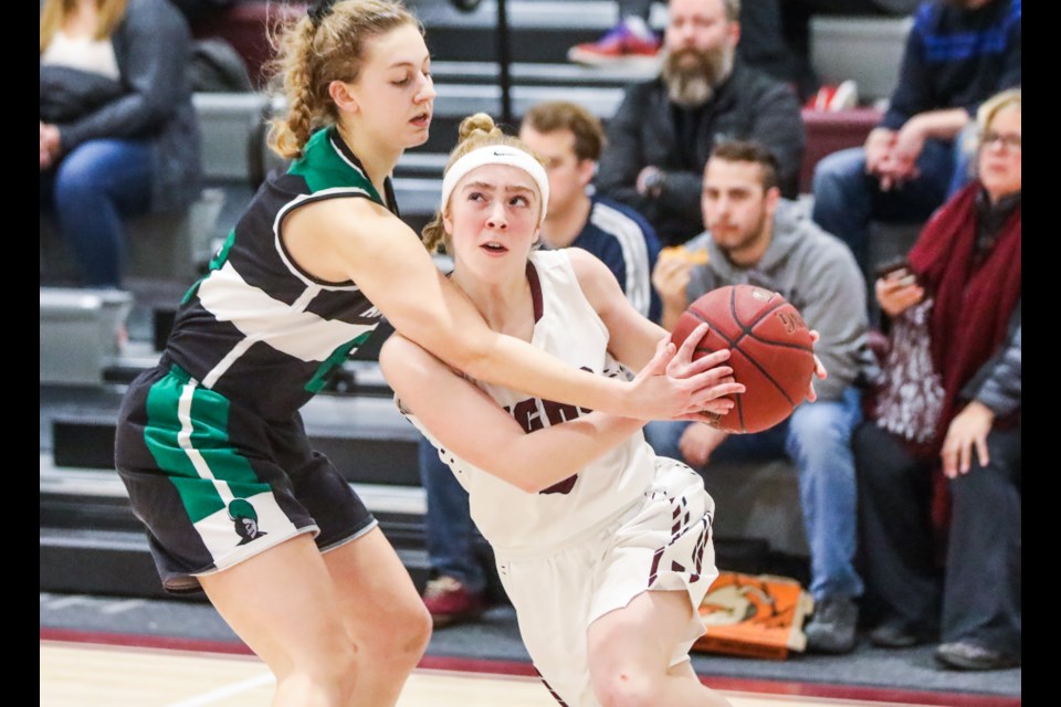 Holy Trinity Academy Knight Lauren Sinclair guards a Foothills Falcon. (Wheel file photo)